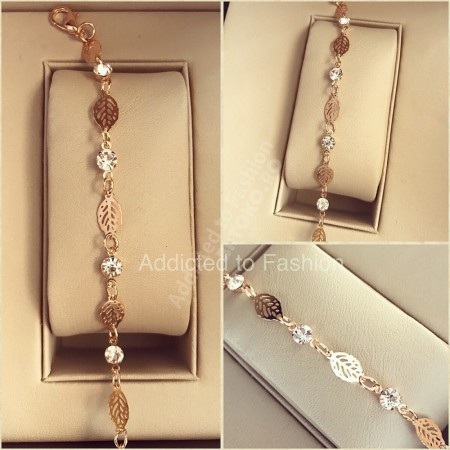 Fashionable gold bracelet with leaves and pebbles
