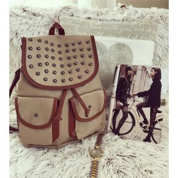 Brown satchel with bumps and outer pockets