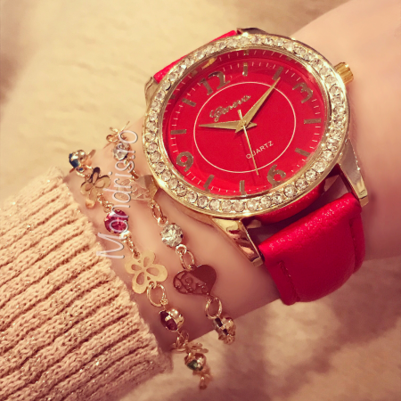 Red and golden woman watch with pearls with two bracelets