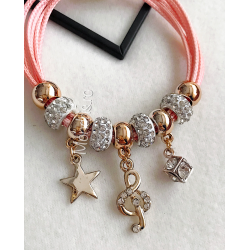 Pink bracelet with beads and other accessories